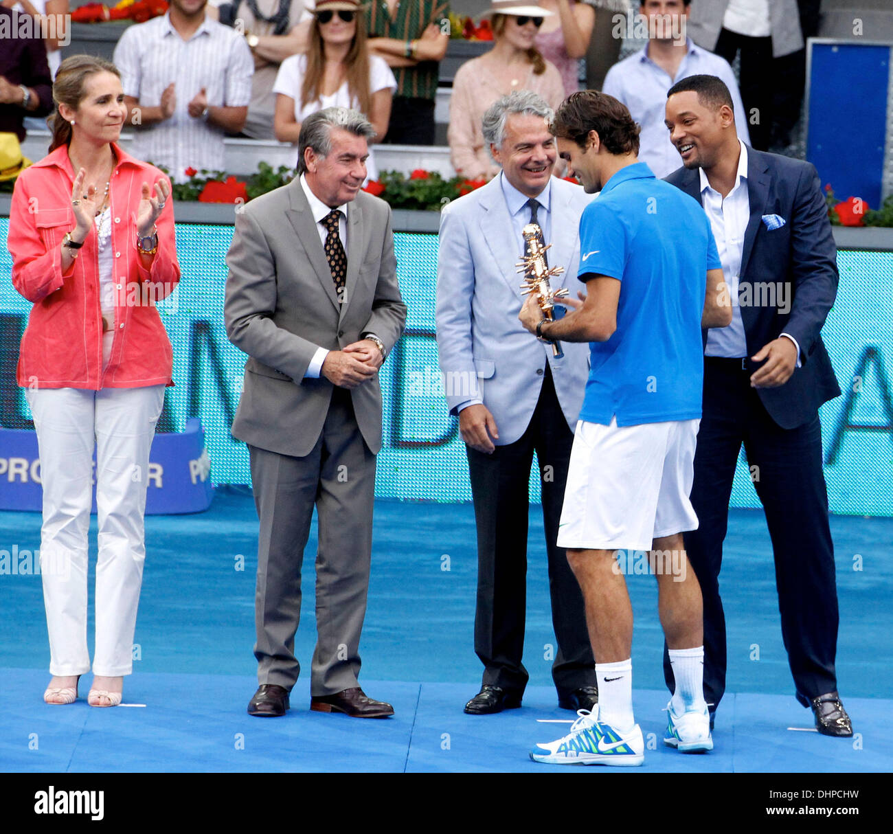 Will Smith and Roger Federer Roger Federer receives his trophy after winning the the final match of the Madrid Masters against Czech Tomas Berdych a at the Magic Box (Caja Magica) sports complex  Madrid, Spain - 13.05.12 Stock Photo