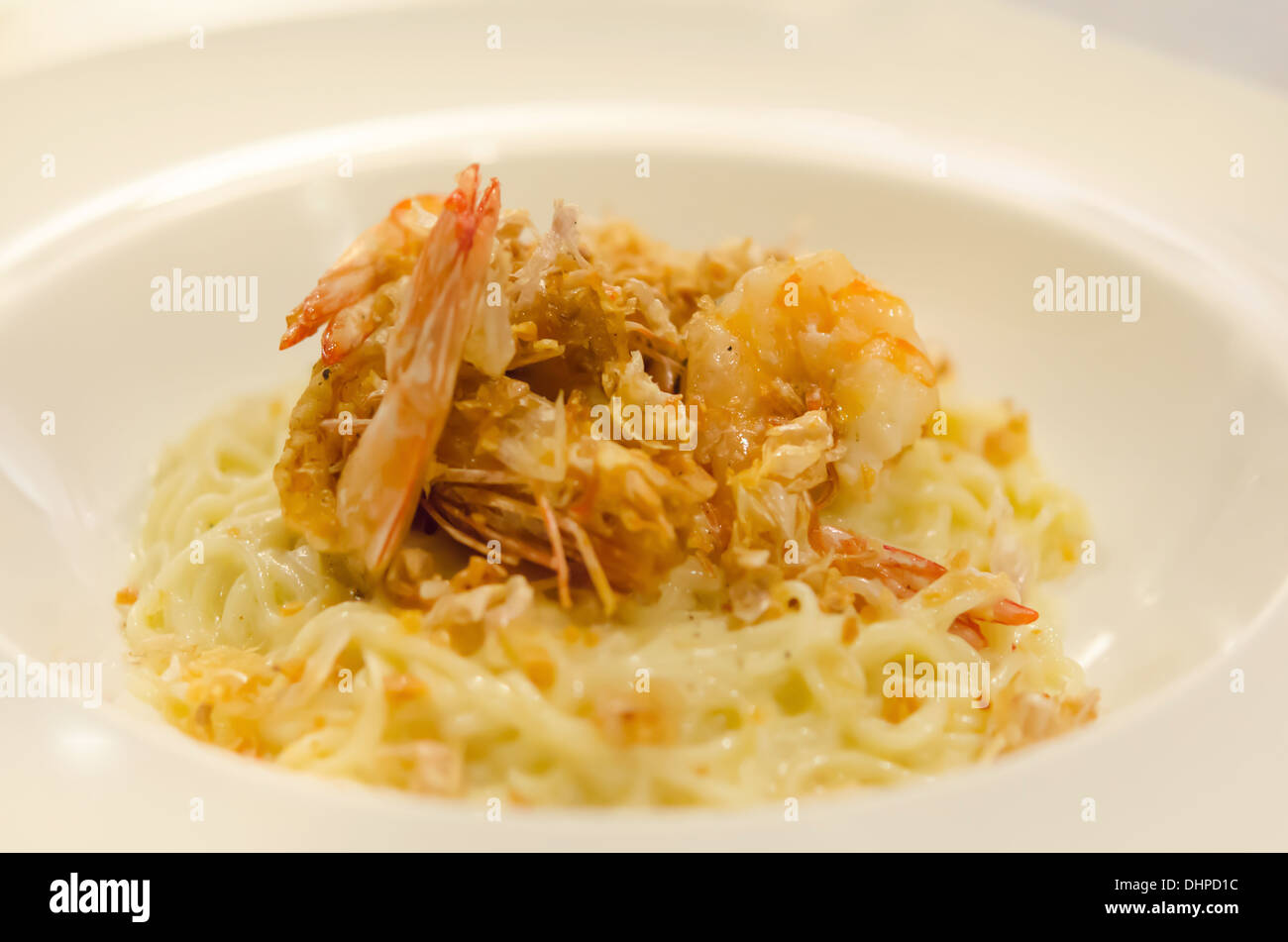 Spaghetti Carbonara with fried shrimp and cheese Stock Photo