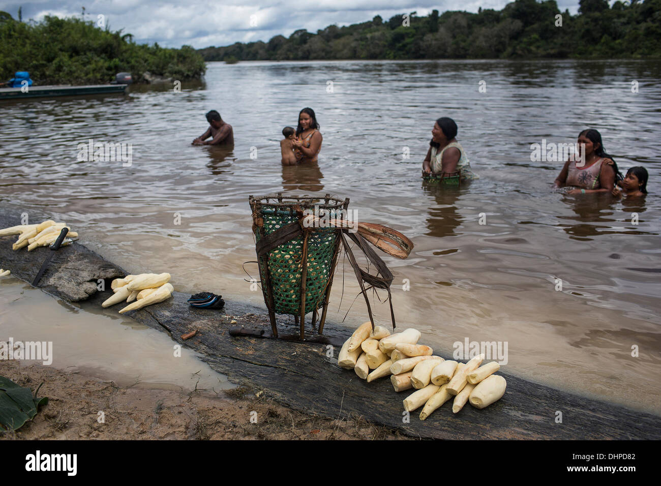 May 9, 2013 - Poti-Kro, Para, Brazil - Much daily activity happens at the riverside. Here, Xikrin women combine washing harvested yucca with bathing. The indigenous Xikrin people live on the Bacaja, a tributary of the Xingu River, where construction of the Belo Monte Dam is reaching peak construction. Some scientists warn that the water level of the Bacaja will decrease precipitously due to the dam. (Credit Image: © Taylor Weidman/ZUMA Wire/ZUMAPRESS.com) Stock Photo