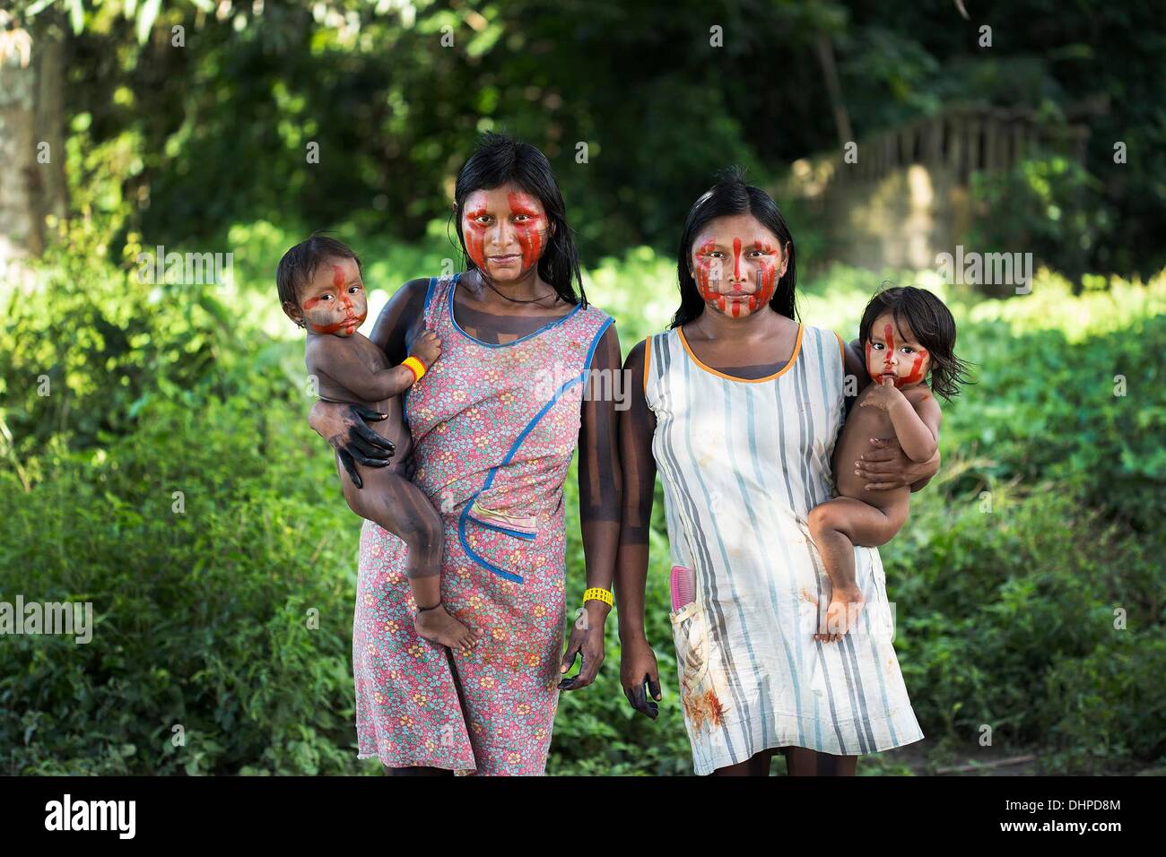 May 2, 2013 - Poti-Kro, Para, Brazil - Nhakri And Nhgreiproti, Xikrin women in the village of Poti-Kro, stand for a portrait under the fruit trees behind their houses. The indigenous Xikrin people live on the Bacaja, a tributary of the Xingu River, where construction of the Belo Monte Dam is reaching peak construction. Some scientists warn that the water level of the Bacaja will decrease precipitously due to the dam. (Credit Image: © Taylor Weidman/ZUMA Wire/ZUMAPRESS.com) Stock Photo