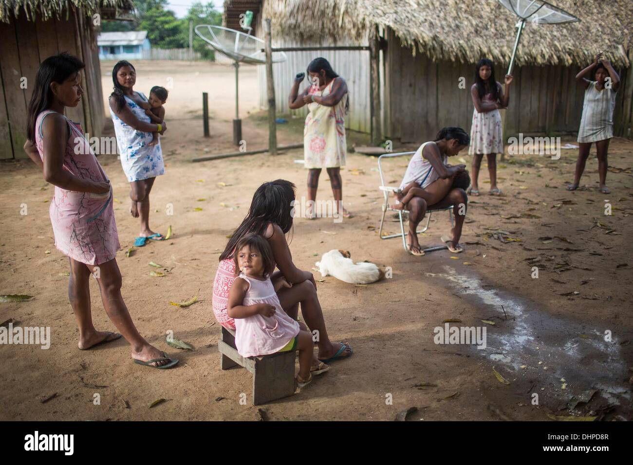 May 6, 2013 - Poti-Kro, Para, Brazil - The Xikrin have distinct gender roles-while the men spend the day hunting and fishing, women often stay in the village to care for the home and the family. The indigenous Xikrin people live on the Bacaja, a tributary of the Xingu River, where construction of the Belo Monte Dam is reaching peak construction. Some scientists warn that the water level of the Bacaja will decrease precipitously due to the dam. (Credit Image: © Taylor Weidman/ZUMA Wire/ZUMAPRESS.com) Stock Photo