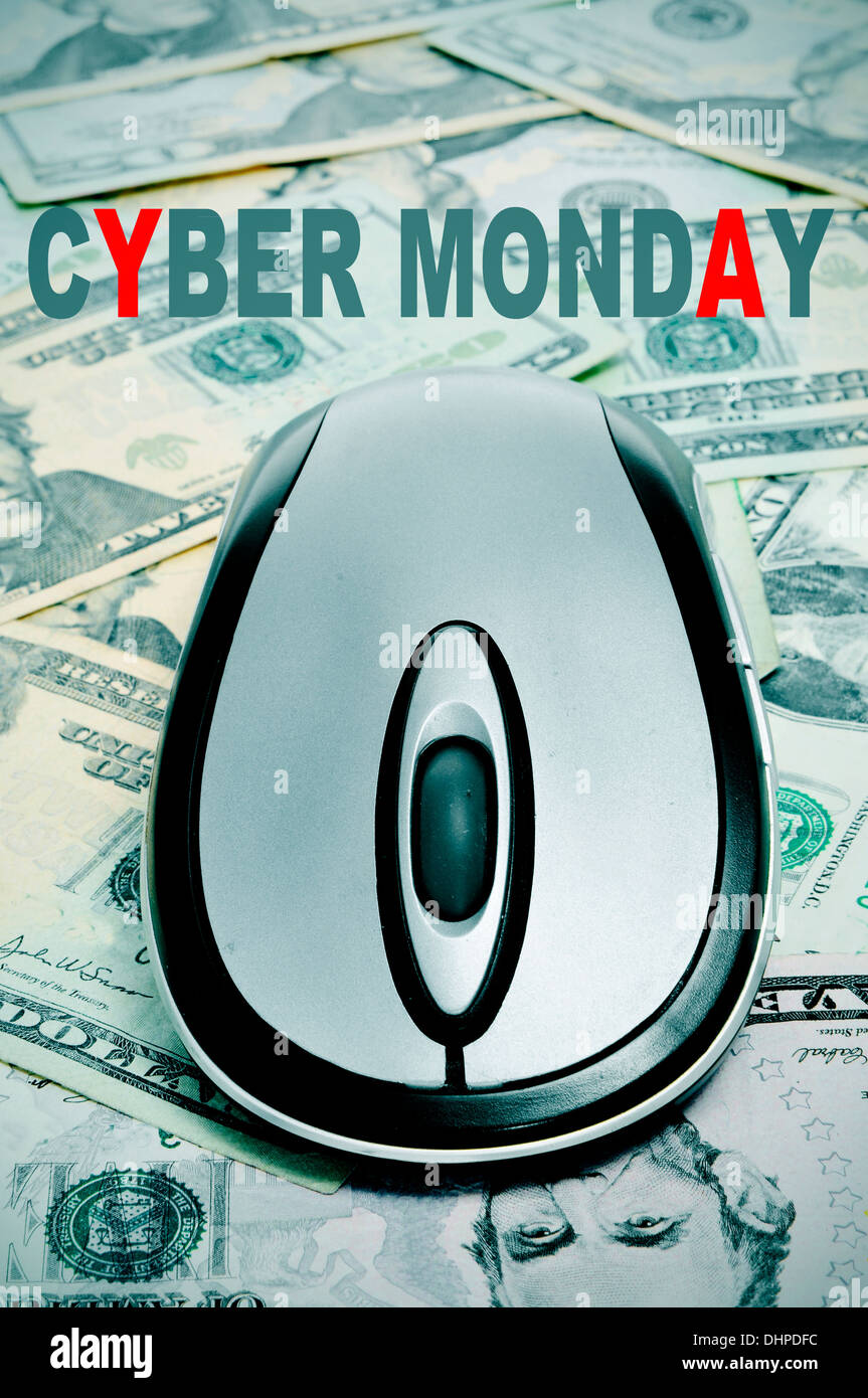 the sentence cyber monday and a computer mouse on a background full of dollar banknotes Stock Photo
