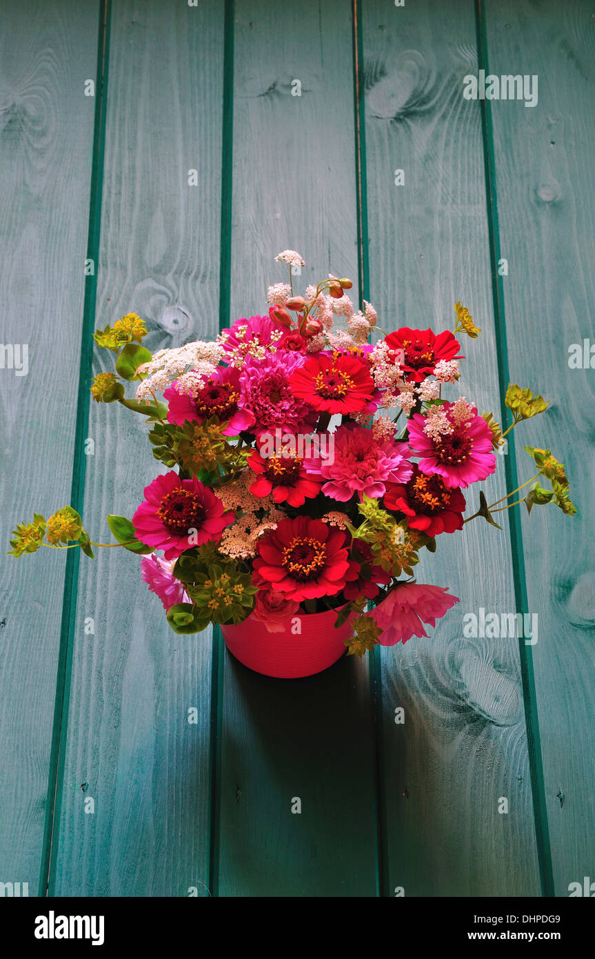 A cut flower arrangement in red and pink UK Stock Photo