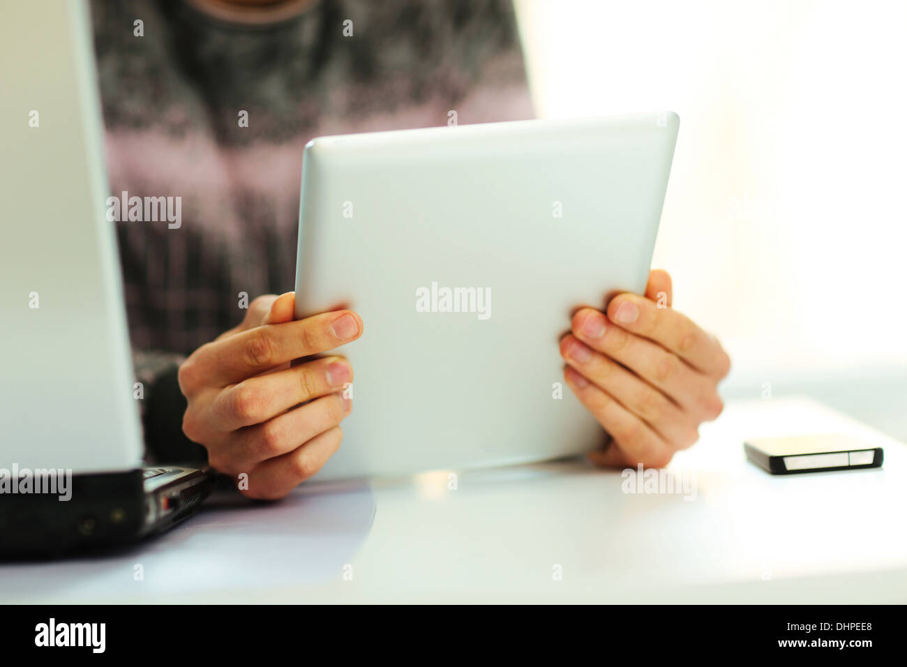 Reading Om Computer Closeup image of a man reading on tablet computer Stock Photo - Alamy