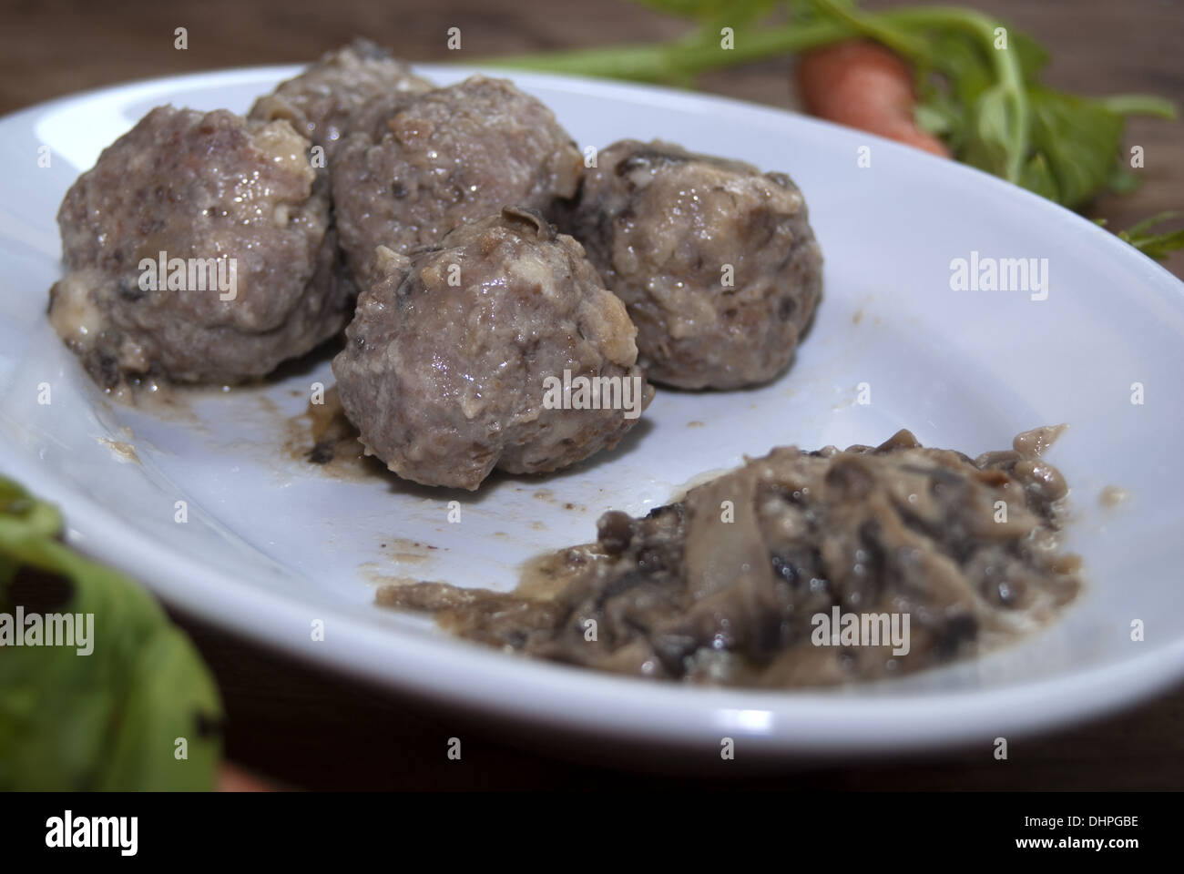 a tasty Italian recipe: meatballs of meat with mushrooms Stock Photo