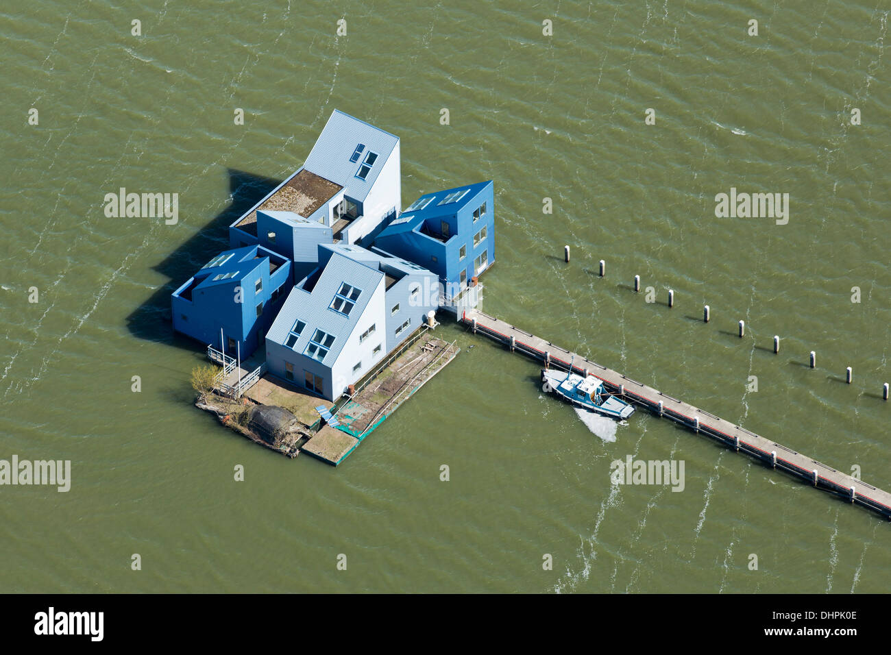 Netherlands, Almere,  Floatinglife. Temporary floating living and working villas on water ( lake called Ijsselmeer ). Aerial. Stock Photo