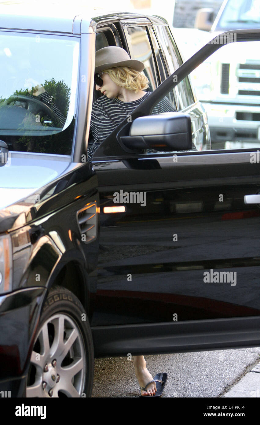 Emma Roberts gets into her car in Beverly Hills Los Angeles, California