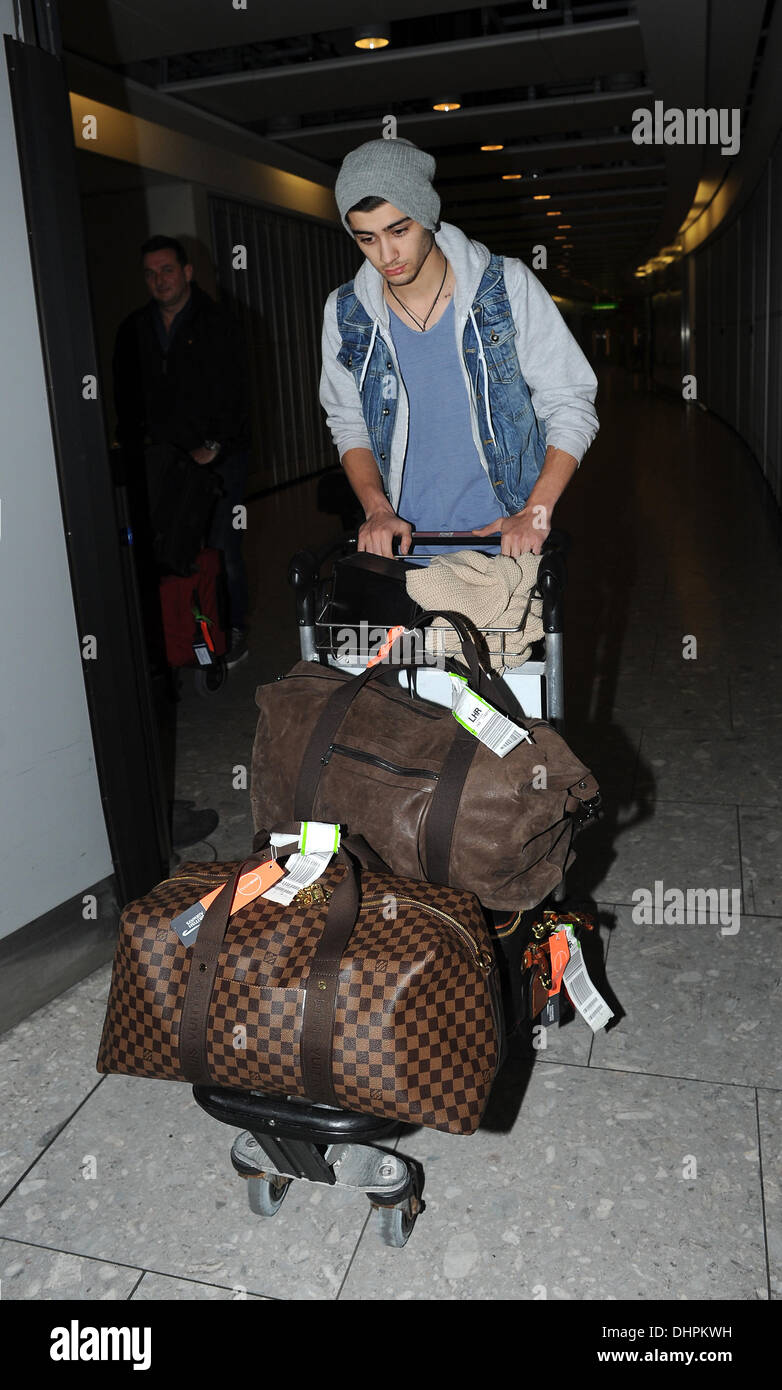 Zayn Malik of One Direction arriving at Heathrow Airport on a late ...