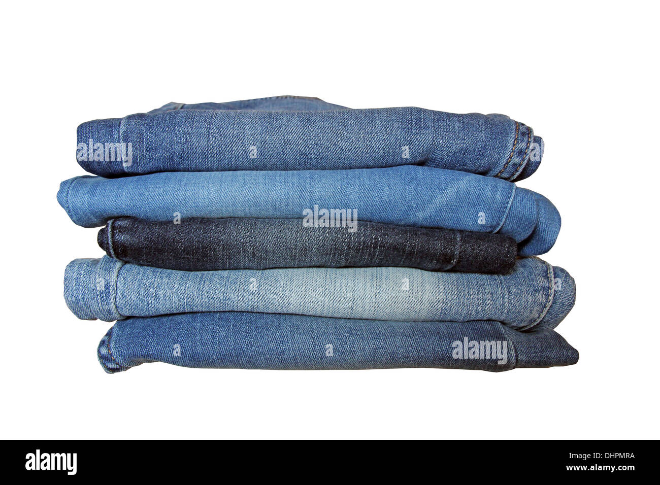 Stack of blue jeans of different shade over white background. Stock Photo