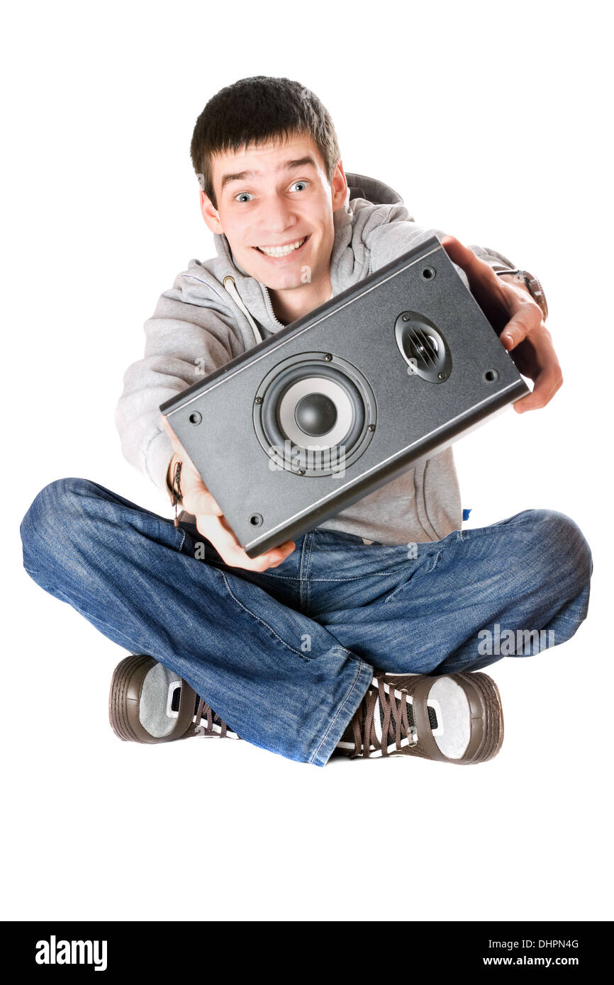 Smiling young man with a speaker in his hands Stock Photo