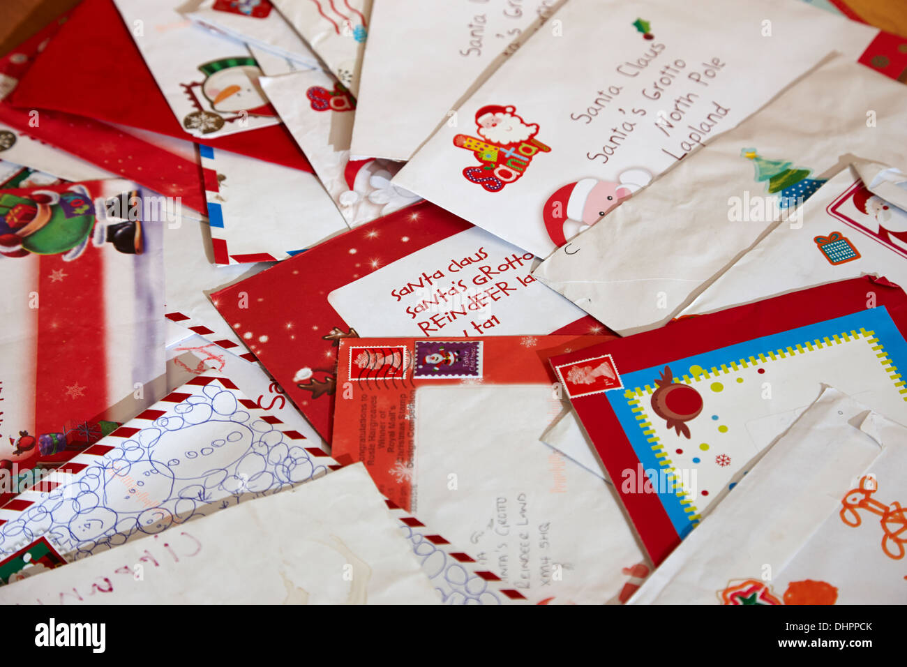 pile of childrens christmas wish list letters to santa claus Stock Photo