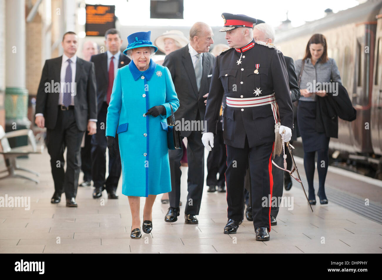 Manchester, UK. 14th November, 2013. Queen Elizabeth II and Prince Philip, Duke of Edinburgh arrive at Piccadilly Train Station in Manchester, greeted by Mr Warren J. Smith, The Lord-Lieutenant of Greater Manchester, ahead of their engagement to officially open the new 'Noma' Co-Op building in the city. Credit:  Russell Hart/Alamy Live News (Editorial use only). Stock Photo
