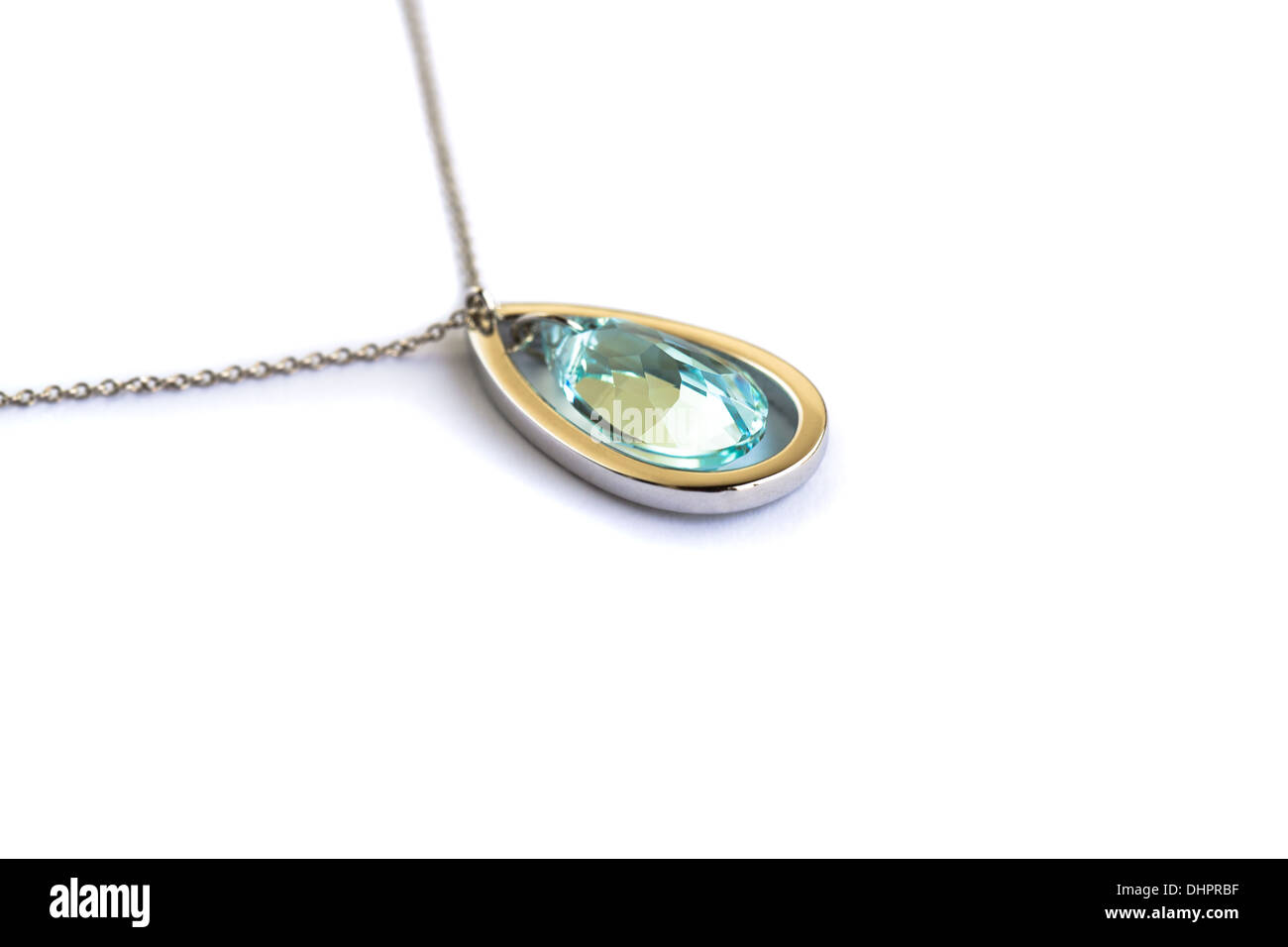 Necklace with blue stone isolated on white background. Stock Photo