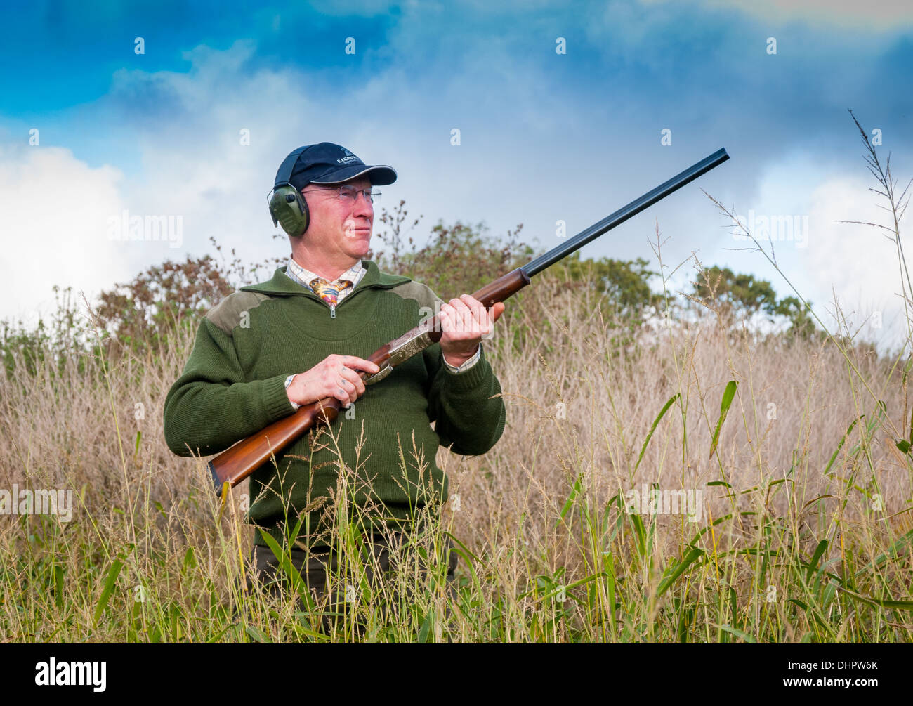 A man with a shotgun stood waiting for the start of a pheasant shoot in