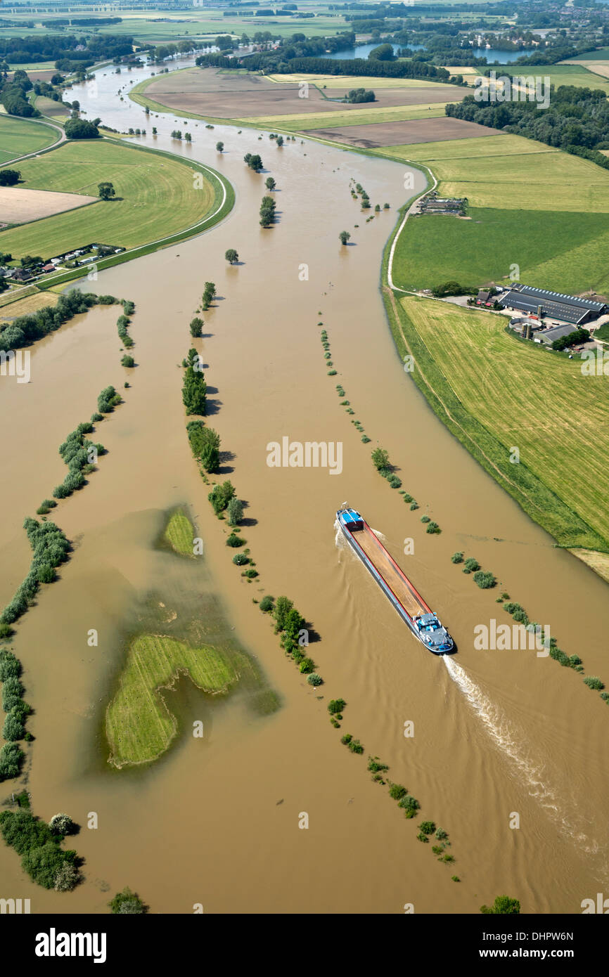 Netherlands, Doesburg. IJssel river. Flood plains. Flooded land. Cargo ship. Aerial Stock Photo