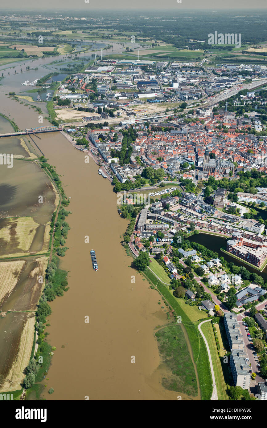 Netherlands, Zutphen. IJssel river. City center. Flood plains. Flooded land. Cargo ship. Aerial Stock Photo