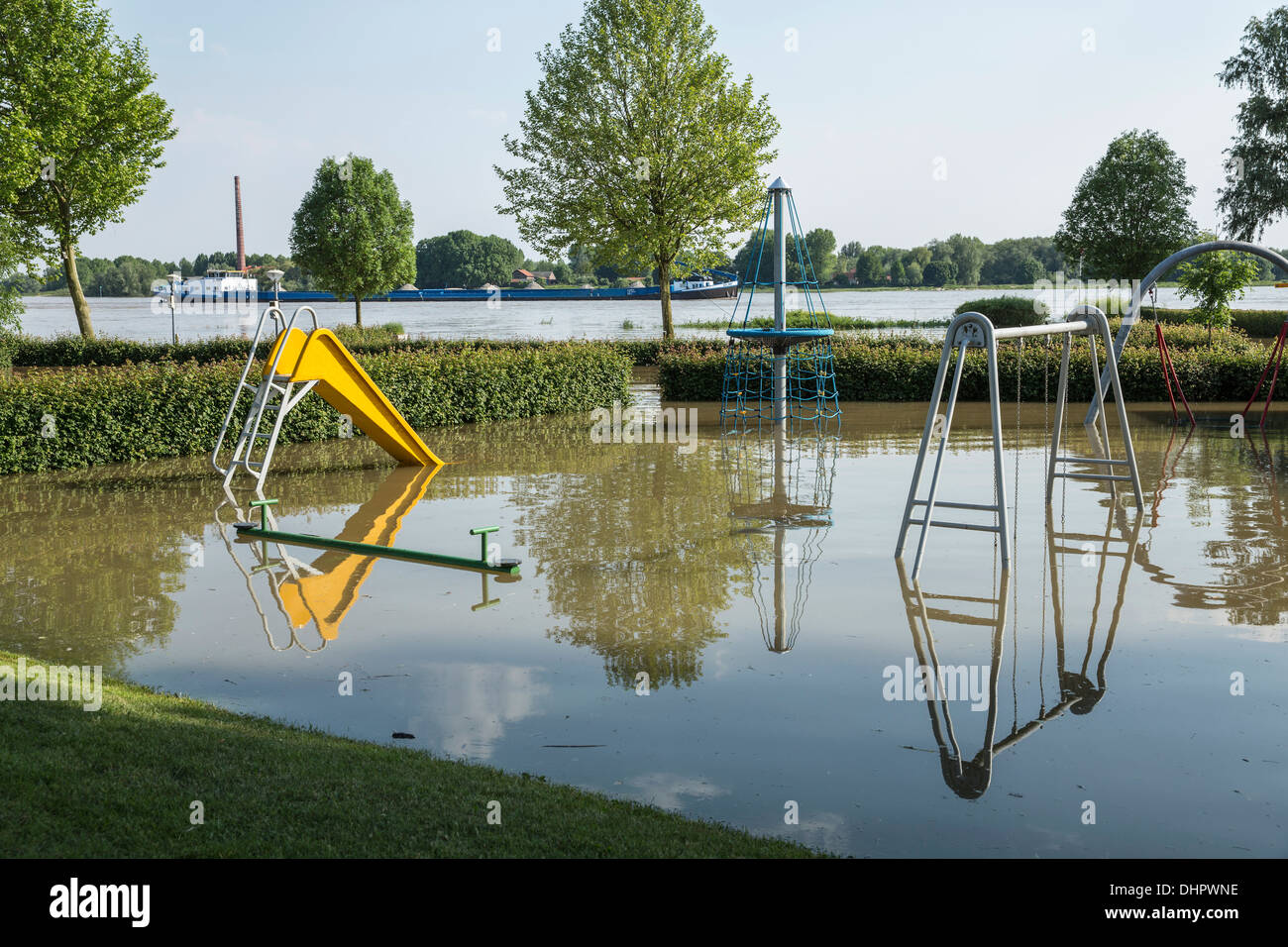 Netherlands, Slijk-Ewijk, Playground on camping site in the flood plains of the Waal river. High water Stock Photo