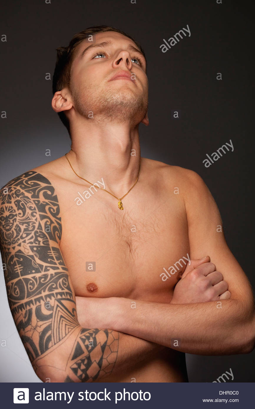 Young Man teenager with tattoos portrait handsome Stock