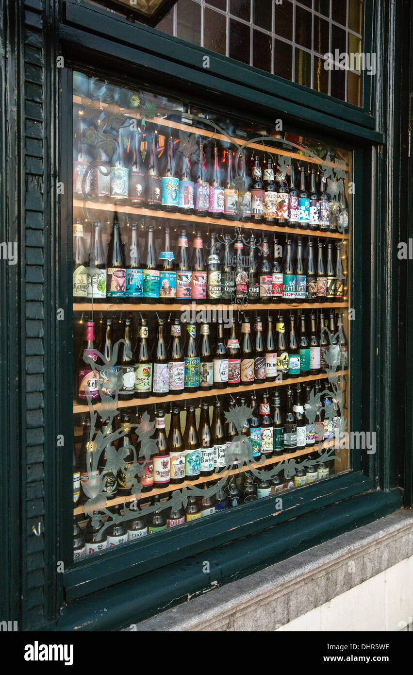 Netherlands, Maastricht, Beer bottles in window of restaurant Stock Photo