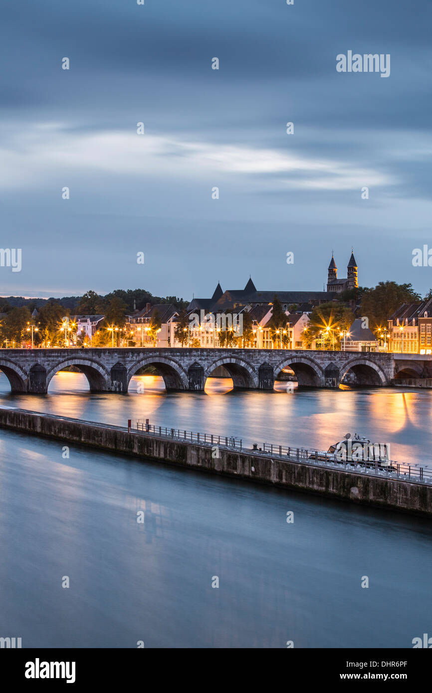 Netherlands, Maastricht, Maas or Meuse river. Bridge called Sint Servaas. Roof of church in background digitally altered Stock Photo
