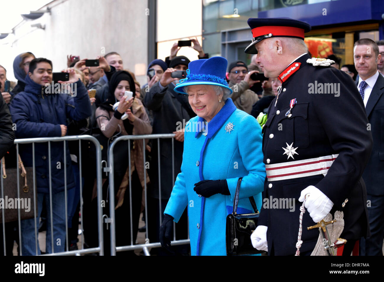Manchester, UK. 14th November 2013. The Queen leaves Piccadilly Station in Manchester accompanied by the Lord-Lieutenant., Warren Smith. On her viisit she officially opens the new eco-friendly Noma Cooperative Society Headquarters. She then moves on to meet disadvantaged young people using the Factory Youth Zone centre in Harpuhey, North Manchester.   14 November 2013 Credit:  John Fryer/Alamy Live News Stock Photo