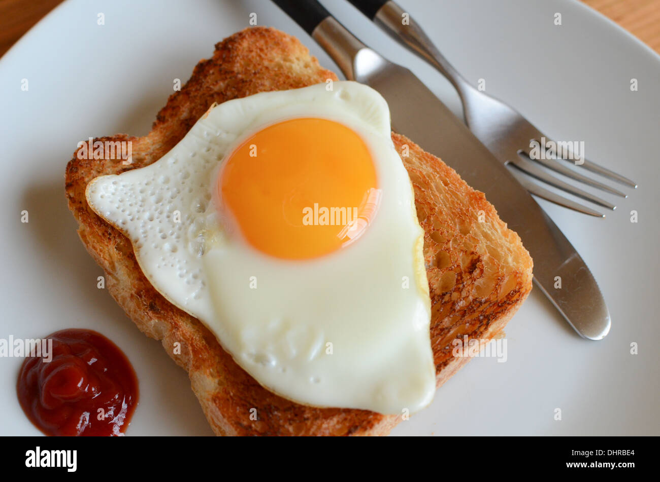 Egg on toast, with ketchup. Stock Photo