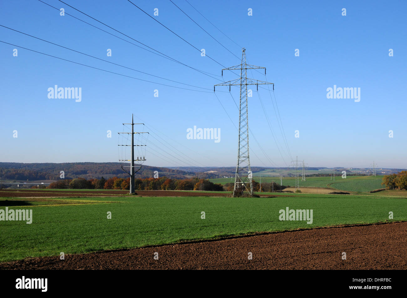 Overhead power line and ground cables Stock Photo