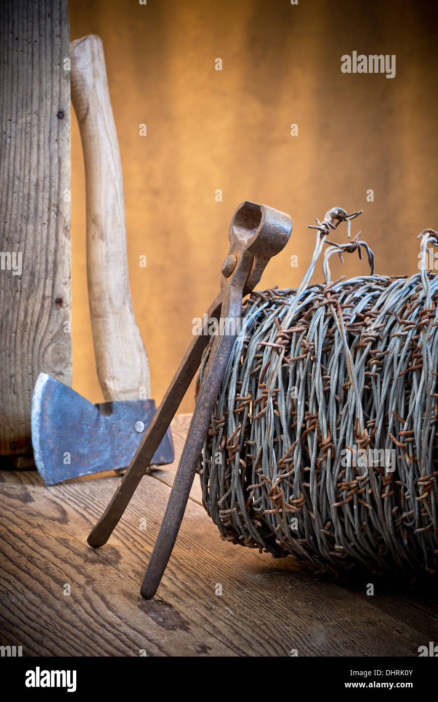still life with barbedwire and old cutter Stock Photo