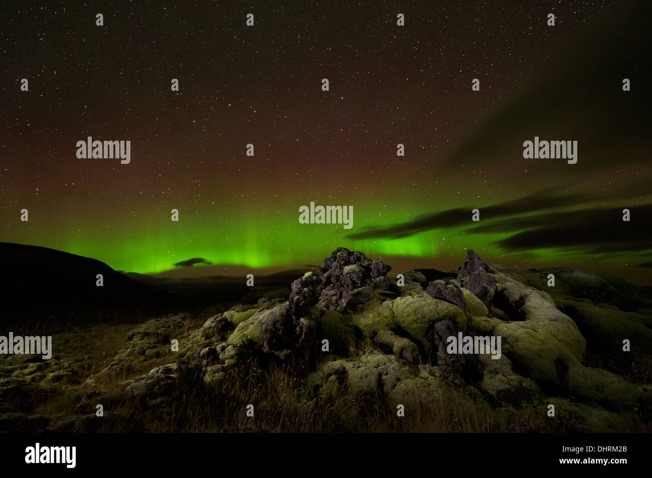 Northern Lights (aurora borealis) are seen with volcanic rock formation in Iceland, September 9, 2013. (Adrien Veczan) Stock Photo