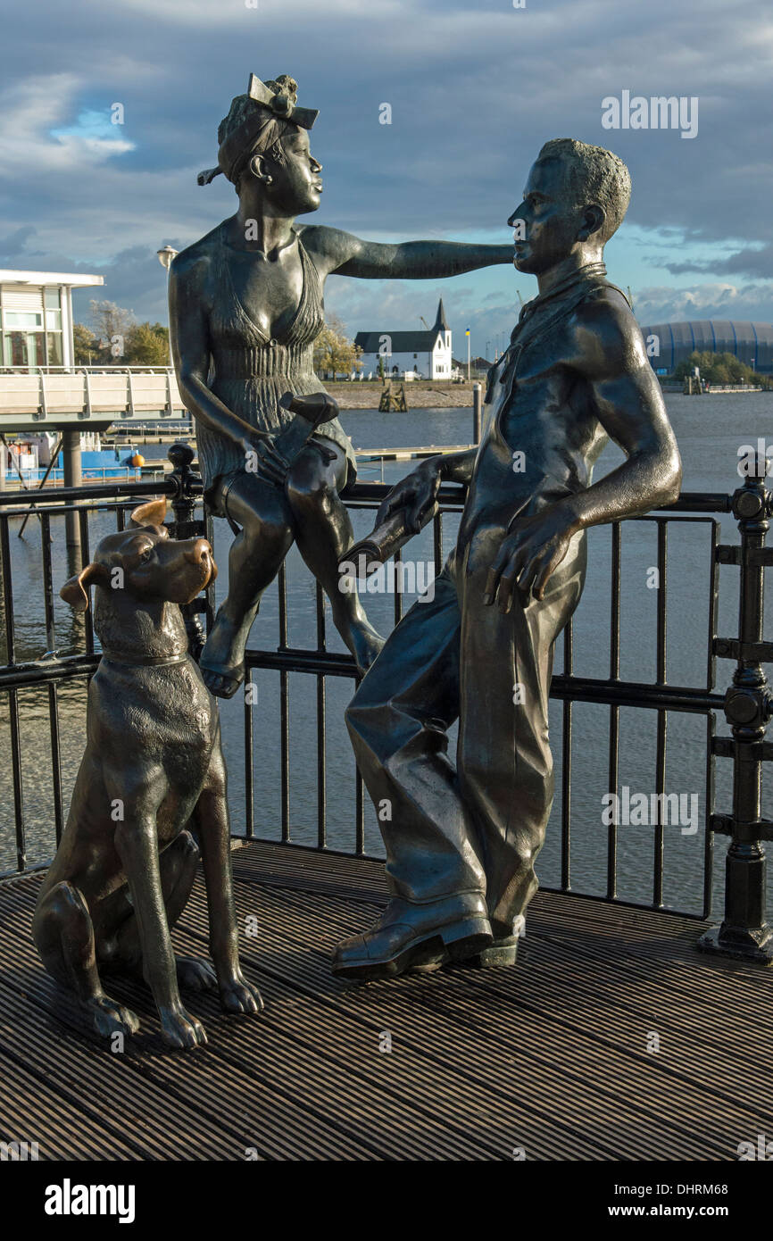 Sculpture of Cardiff Couple and Dog in Cardiff Bay Wales UK by artist