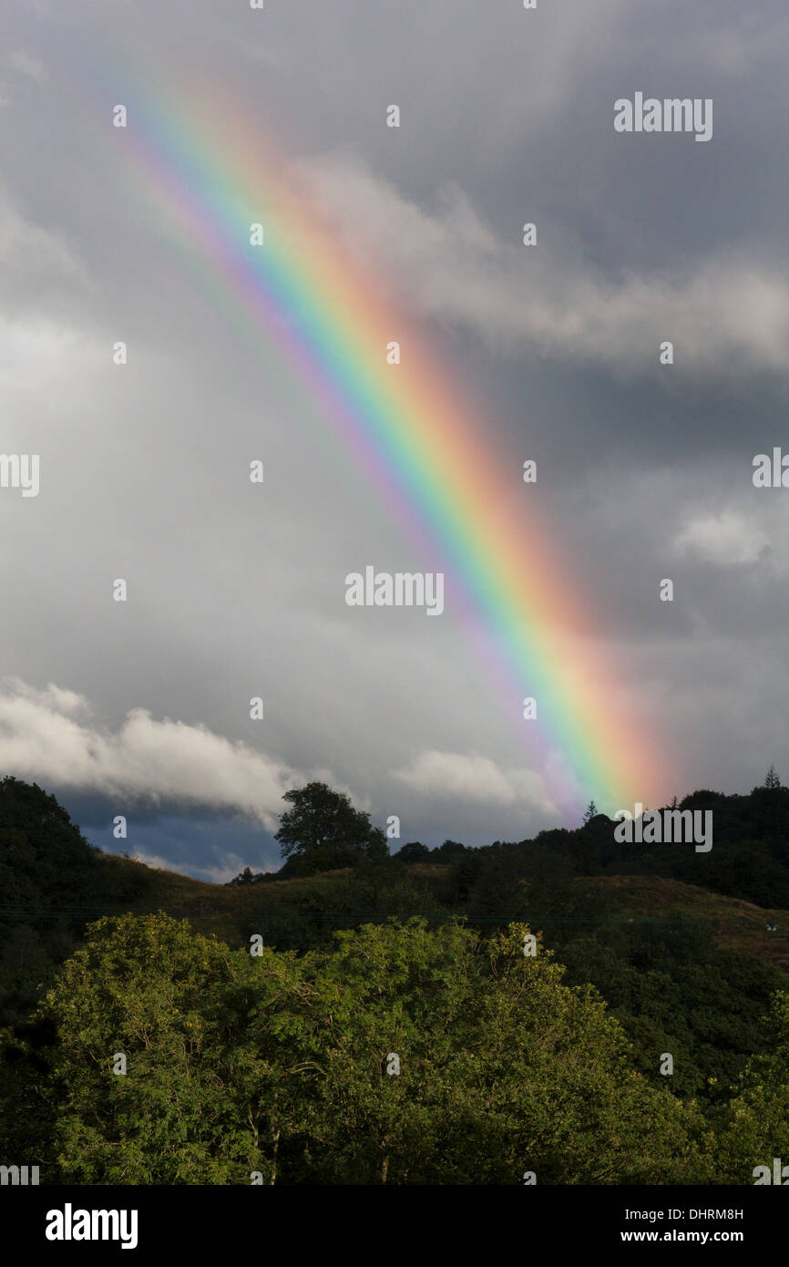 Rainbow against a dark sky hi-res stock photography and images - Alamy
