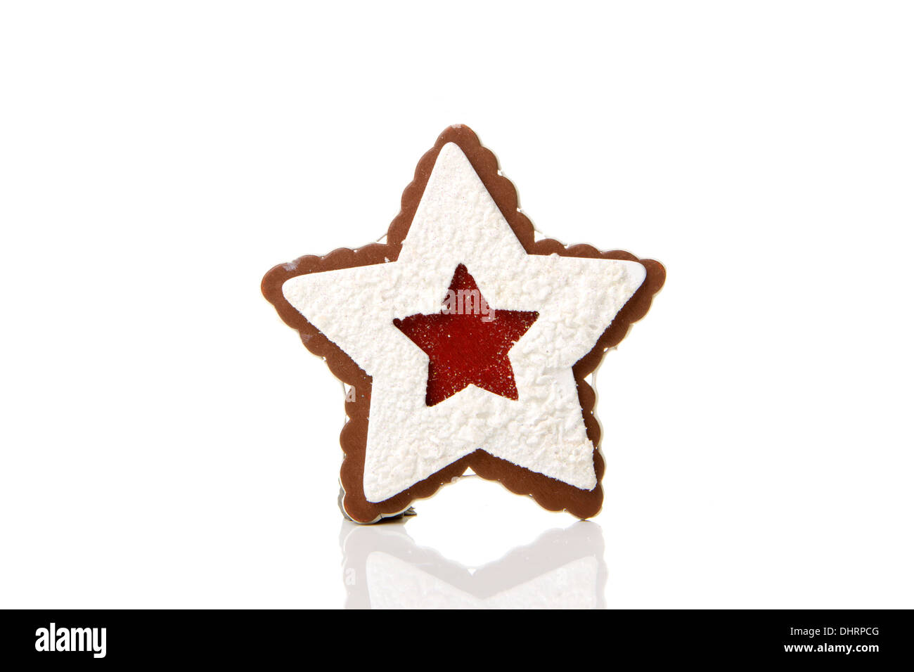 Gingerbread star as a Christmas decoration with white background Stock Photo