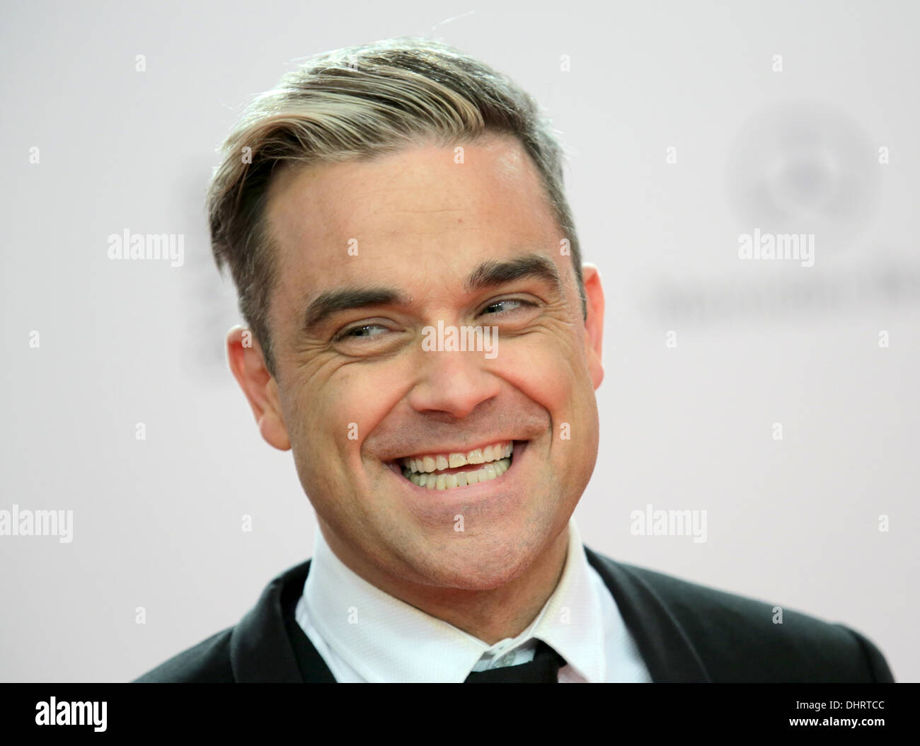 Berlin, Germany. 14th Nov, 2013. British singer Robbie Williams arrives for the 65th Bambi award ceremony at the Stage Theater in Berlin, Germany, 14 November 2013. The Burda media prize will be awarded in 17 categories at the Stage Theater in Berlin on 14 November 2013. Photo: Michael Kappeler/dpa/Alamy Live News Stock Photo