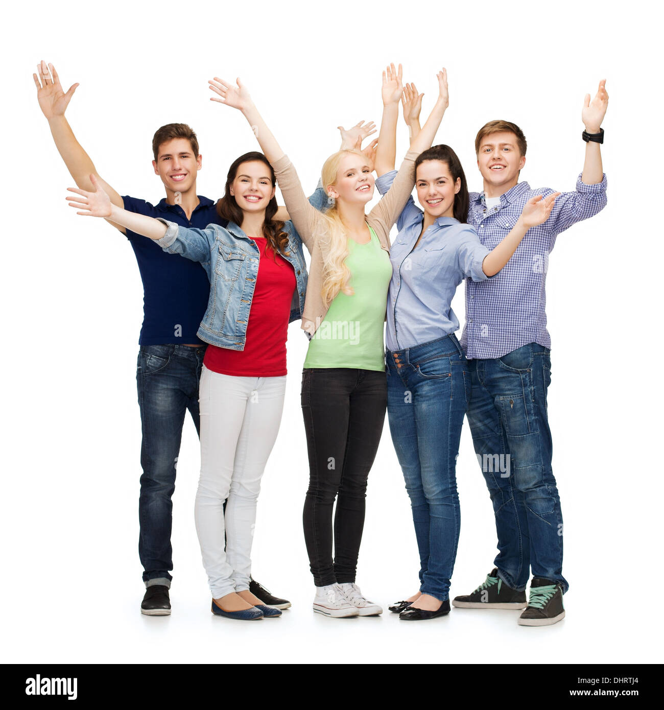 group of smiling students waving hands Stock Photo