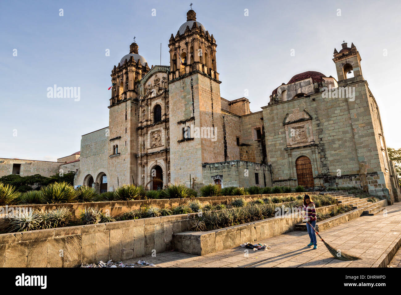 Church of Santo Domingo de Guzmán in the historic district with a street sweeper cleaning the plaza October 30, 2013 in Oaxaca, Stock Photo