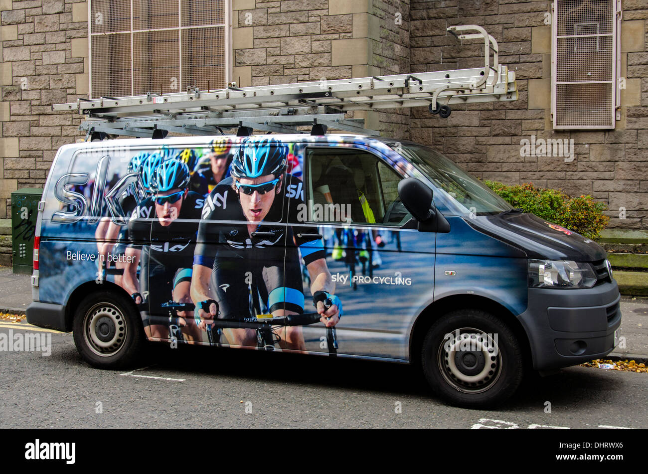 Sky Television aerial installation van with a photograph of the Sky cycling team on the side. Stock Photo