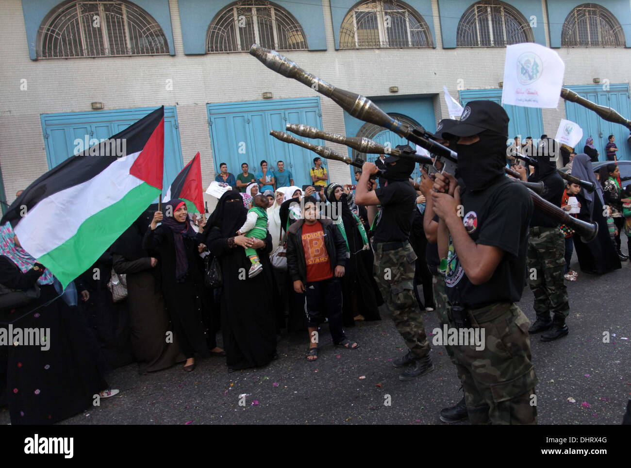 Gaza City, Gaza Strip, Palestinian Territory, . 14th Nov, 2013. Palestinian militants of the Ezzedine al-Qassam Brigades, Hamas's armed wing, stage an anti-Israel parade as part of the celebrations marking the first anniversary of an Israeli army operation in Gaza, on November 14, 2013. A year after trading fire in a week-long war in Gaza, in which more than 170 Palestinians and six Israelis were killed, Israel and Hamas are squaring up for another confrontation, despite both sides appearing reluctant to make the first move Credit:  Ashraf Amra/APA Images/ZUMAPRESS.com/Alamy Live News Stock Photo