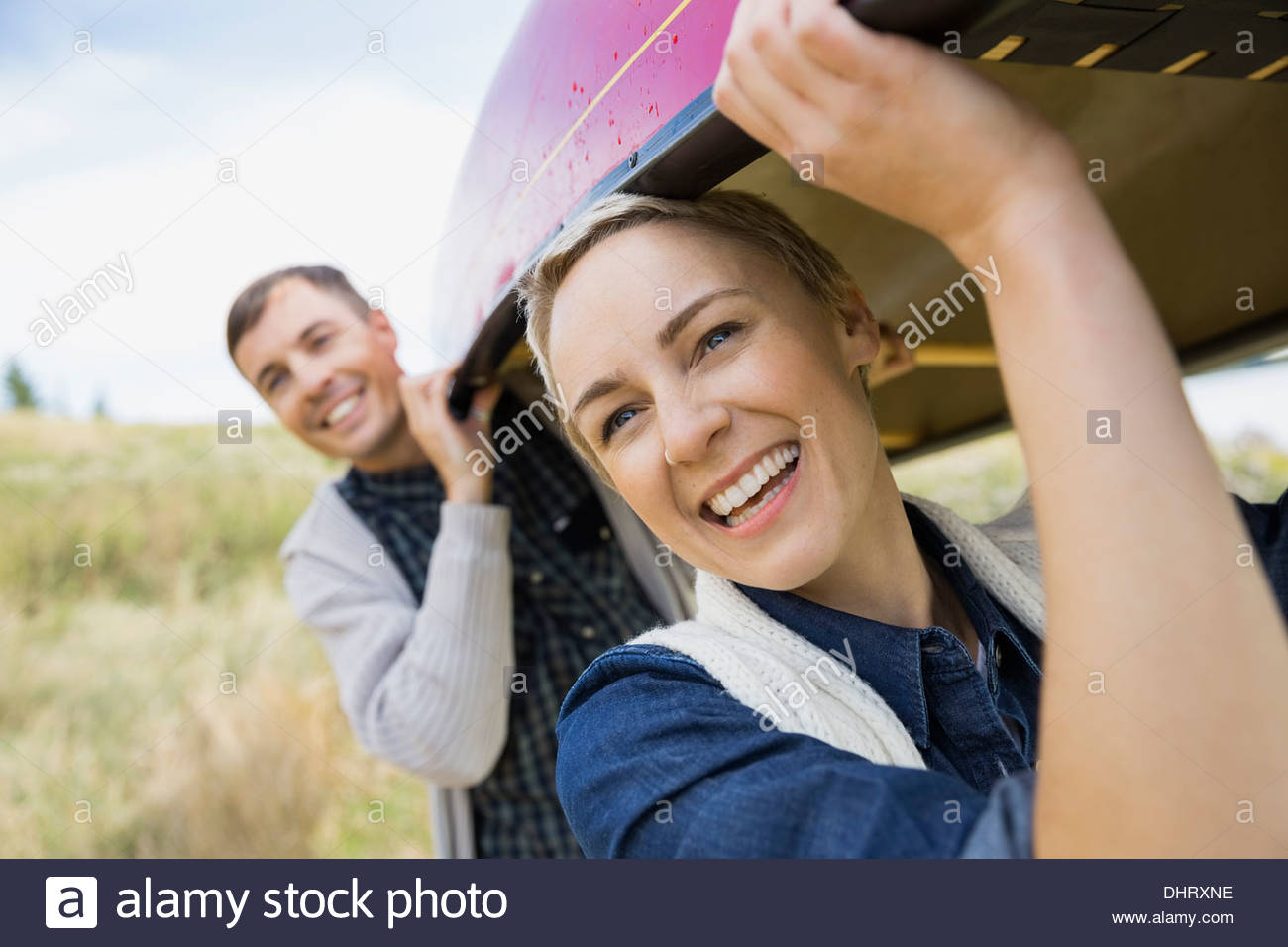 Couple carrying canoe hires stock photography and images Alamy