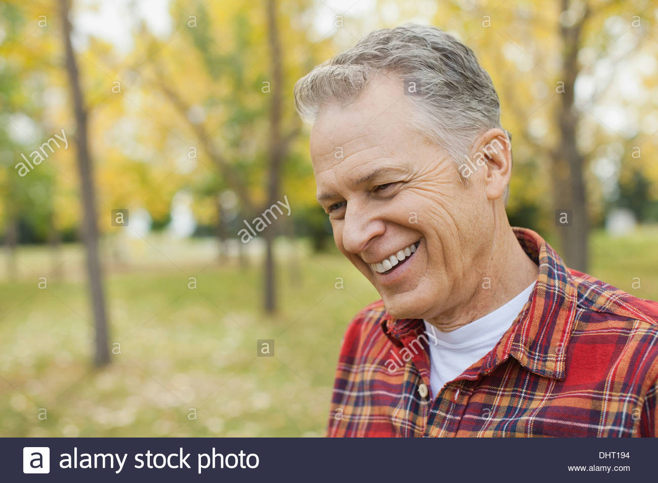 Smiling mature man at park Stock Photo