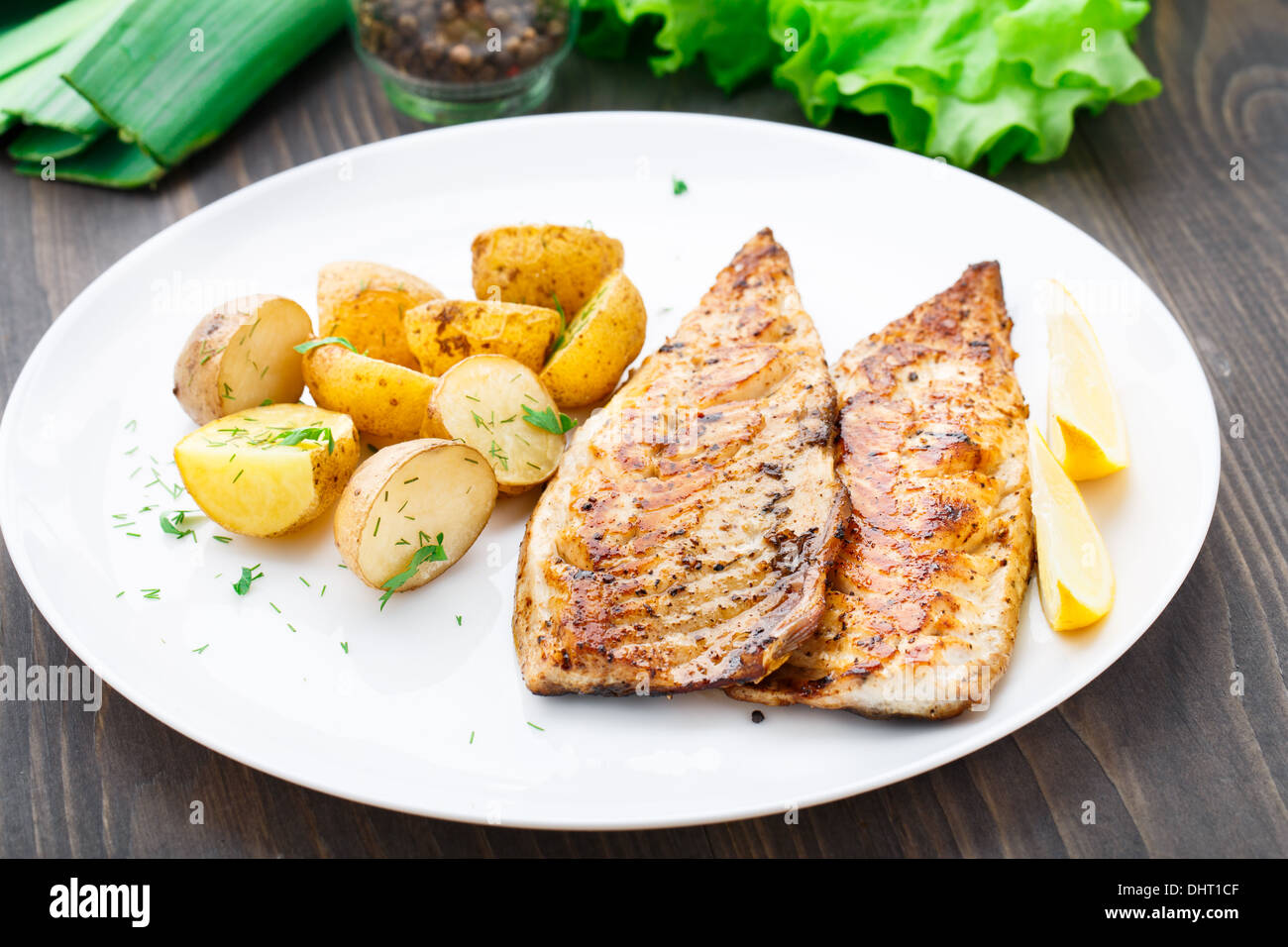 Fried mackerel with baked potato Stock Photo Alamy