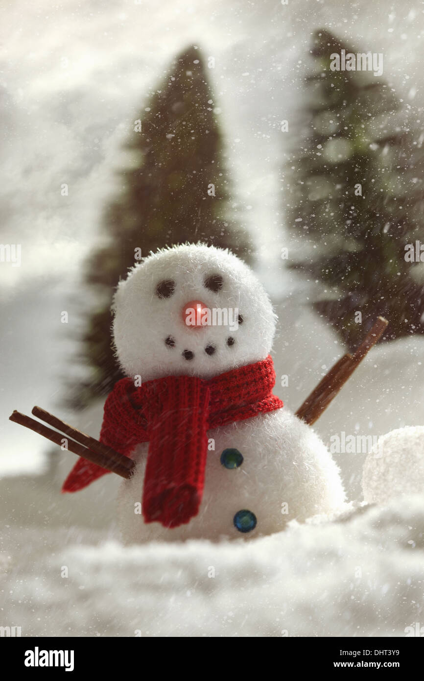 Cute frost ice snowman in winter snow background. Christmas theme