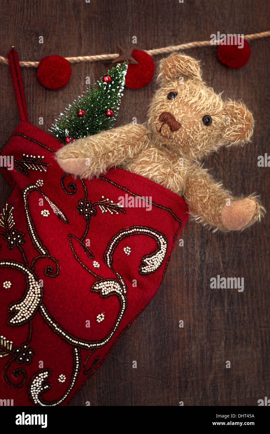 Antique teddy bear in stocking for Christmas Stock Image