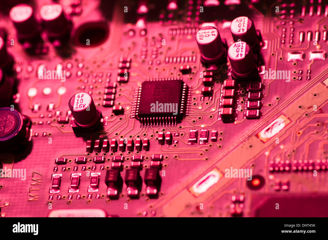 Printed circuit board in red light. Stock Photo