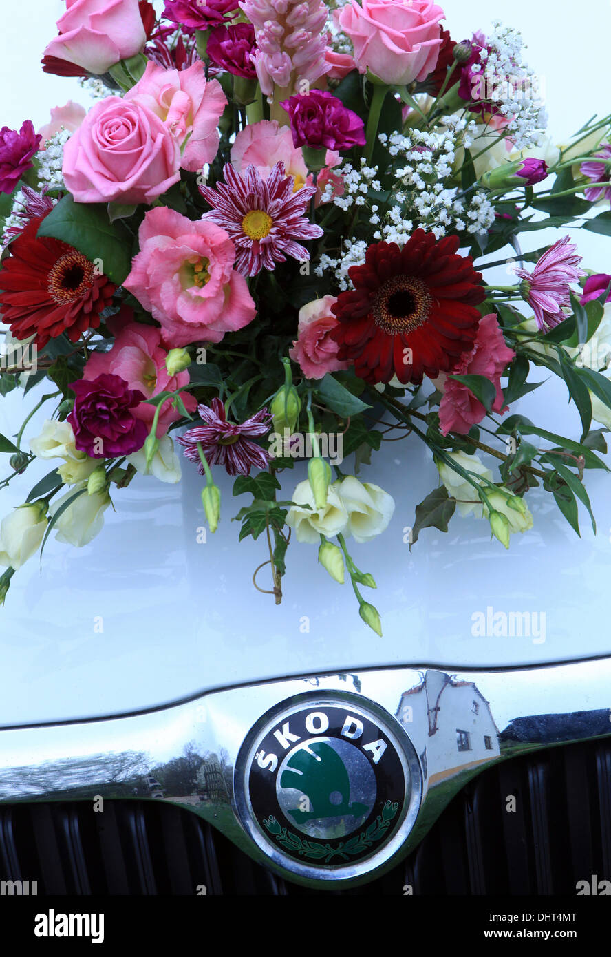 Wedding bouquet on the car hood Stock Photo
