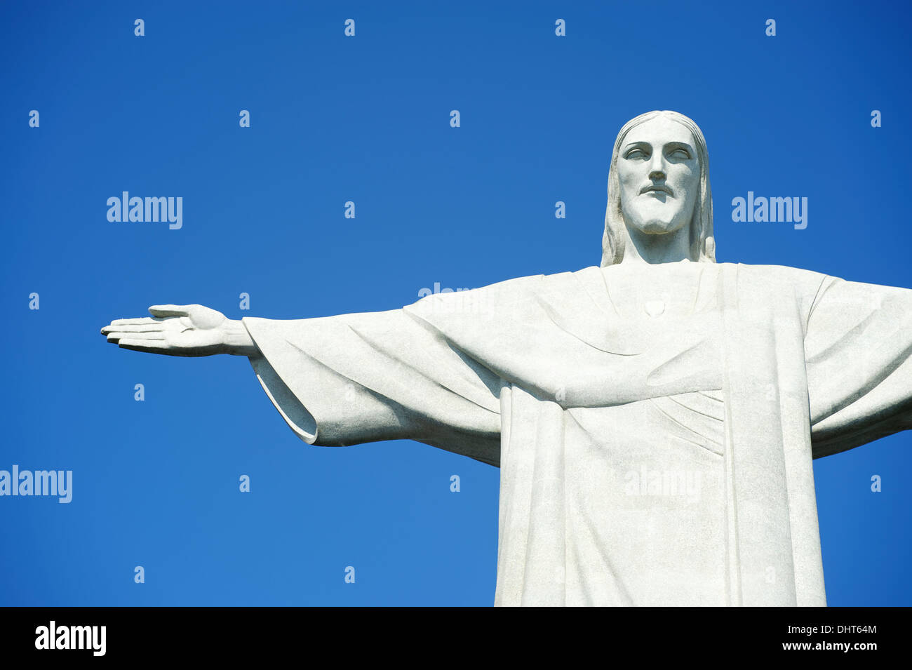 Corcovado Christ the Redeemer stands in blue sky in Rio de Janeiro Brazil Stock Photo