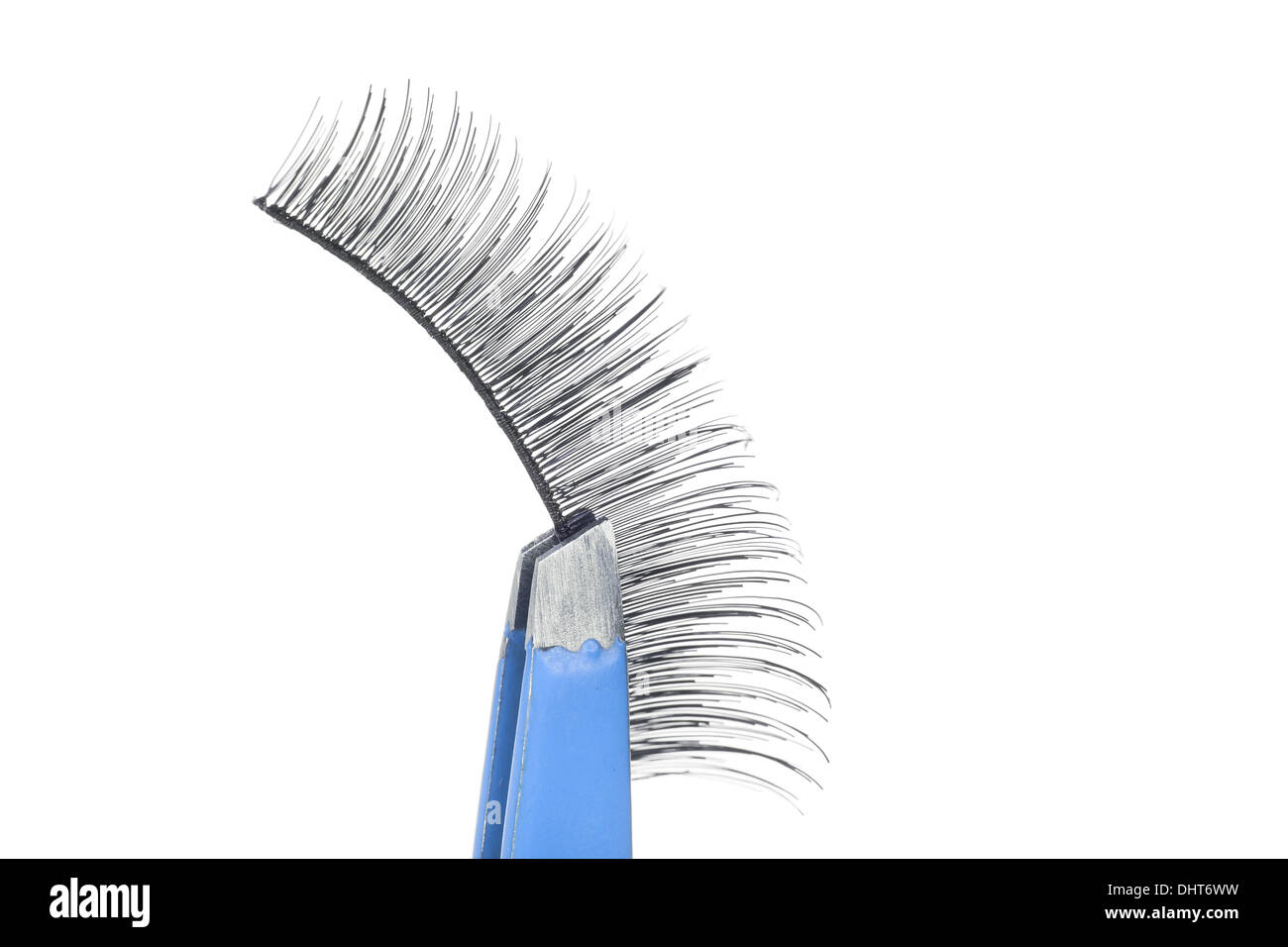 False lashes and blue pincers, closeup on white background  Stock Photo