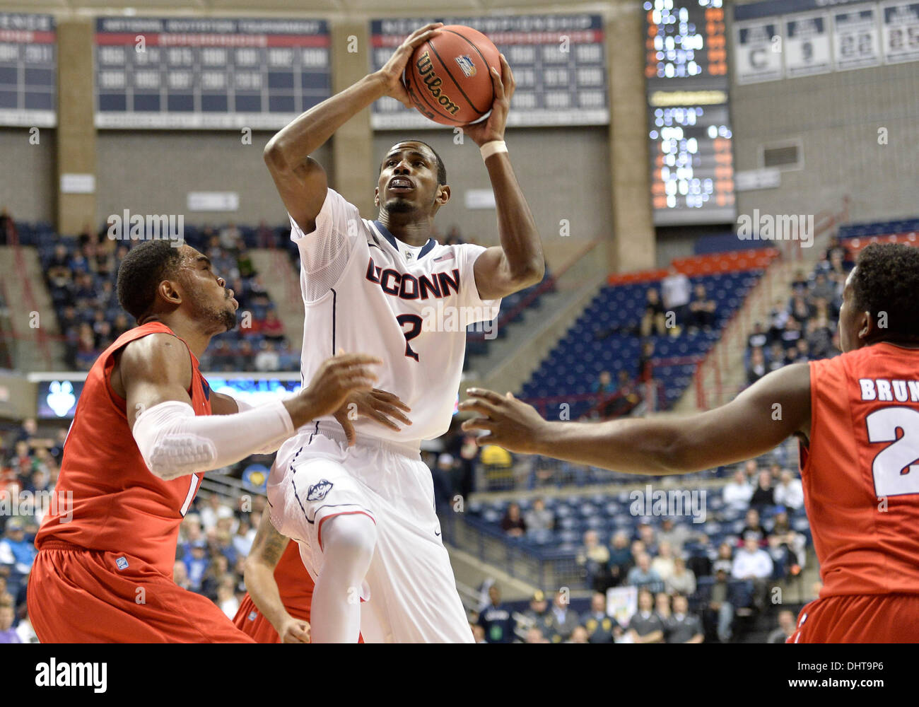 Storrs, CT, USA. 14th Nov, 2013. Thursday November 14, 2013: Connecticut Huskies forward DeAndre Daniels (2) drives to the basket against Detroit Titans center Ugochukwu Njoku (15) and Detroit Titans guard Carlton Brundidge (23) during the 1st half of the NCAA basketball game between Detroit and Connecticut at Gampel Pavilion in Storrs, CT. UConn went on to beat Detroit very easily 101-55. Bill Shettle / Cal Sport Media. Credit:  csm/Alamy Live News Stock Photo