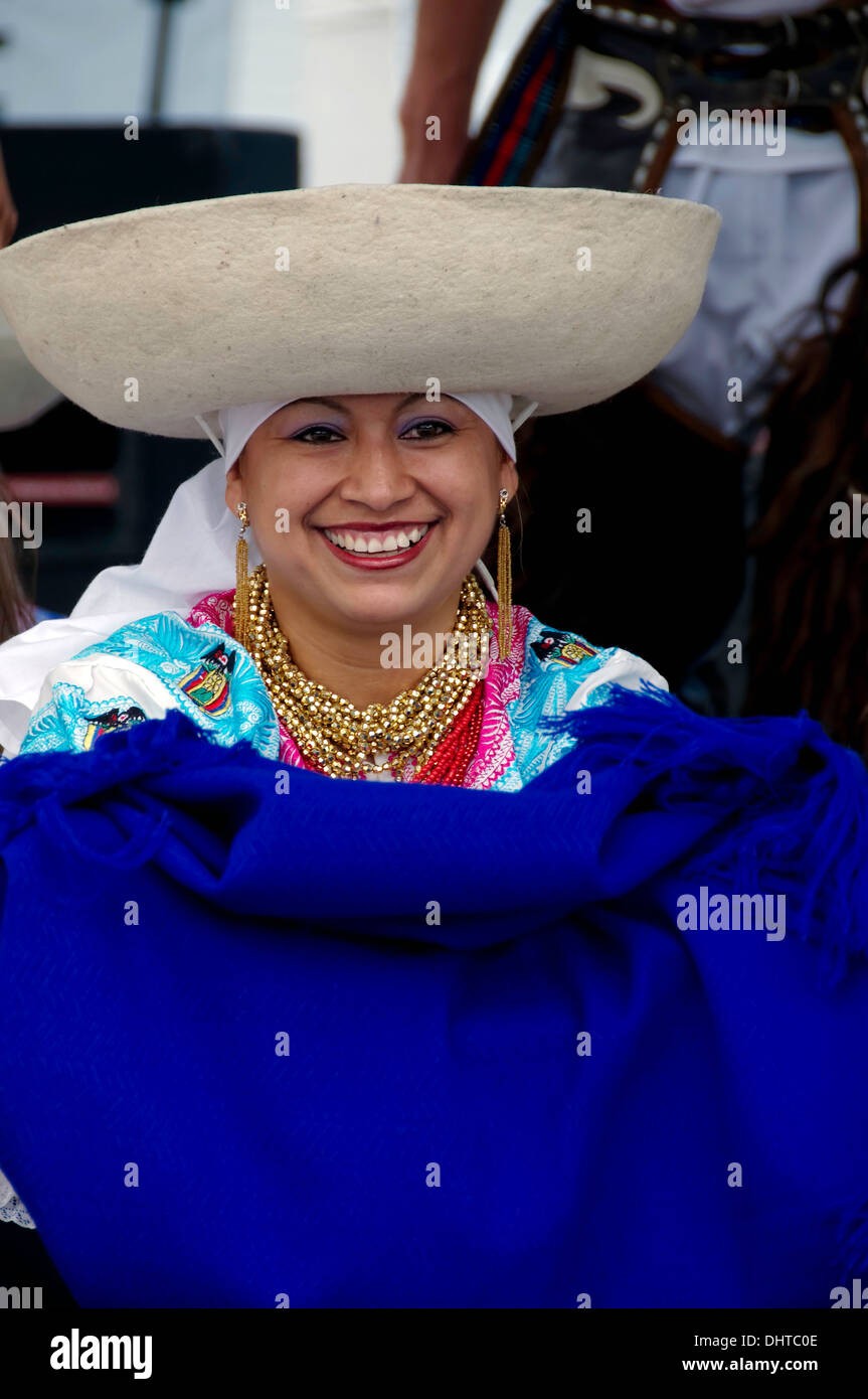 Smiling Central American female dancer in traditional costume wearing