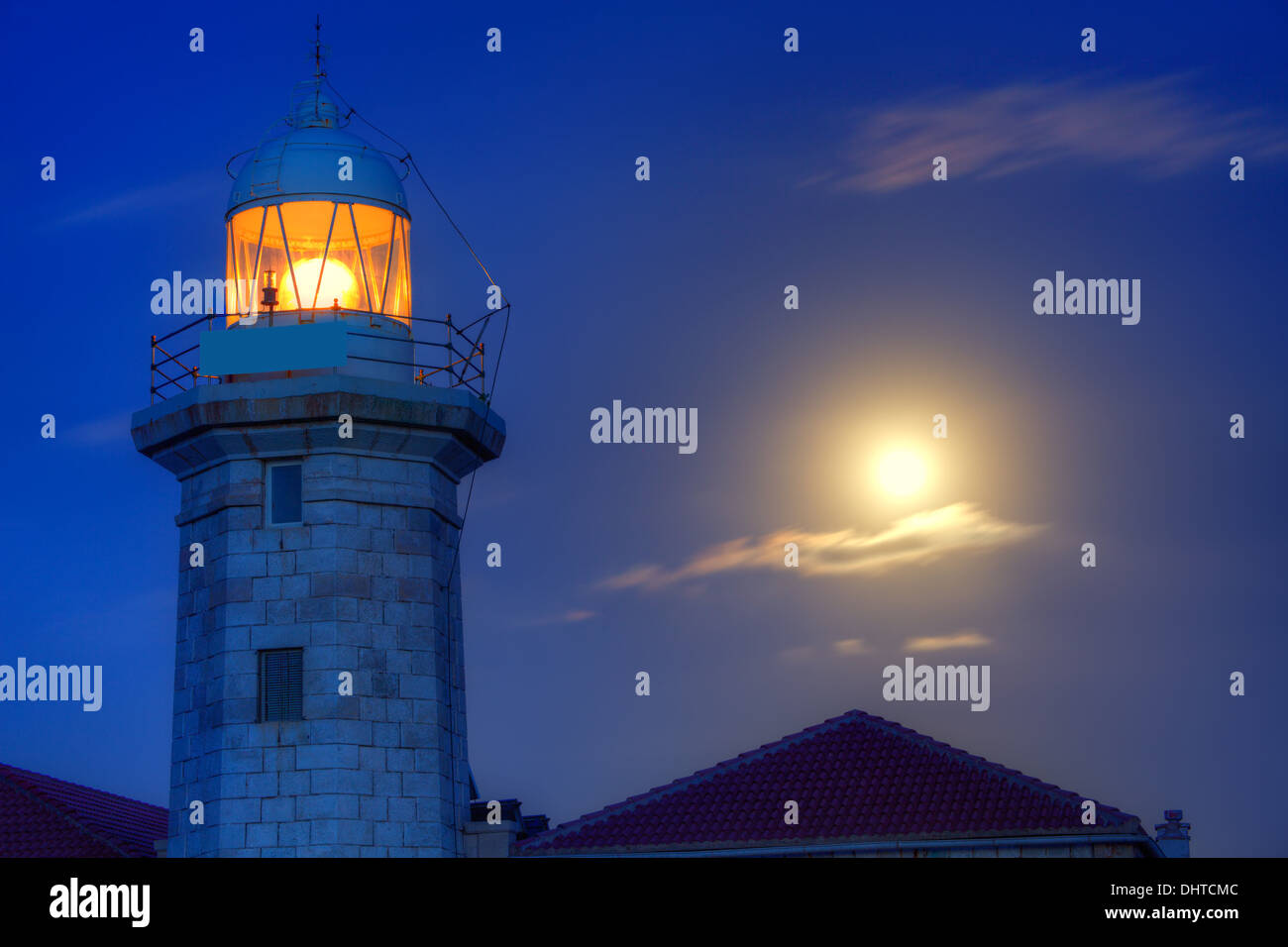 Ciutadella Menorca Punta Nati lighthouse with moon shining in sky Stock Photo