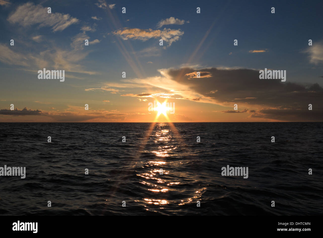 Dramatic beautiful sunset with clouds over the Baltic sea Stock Photo ...